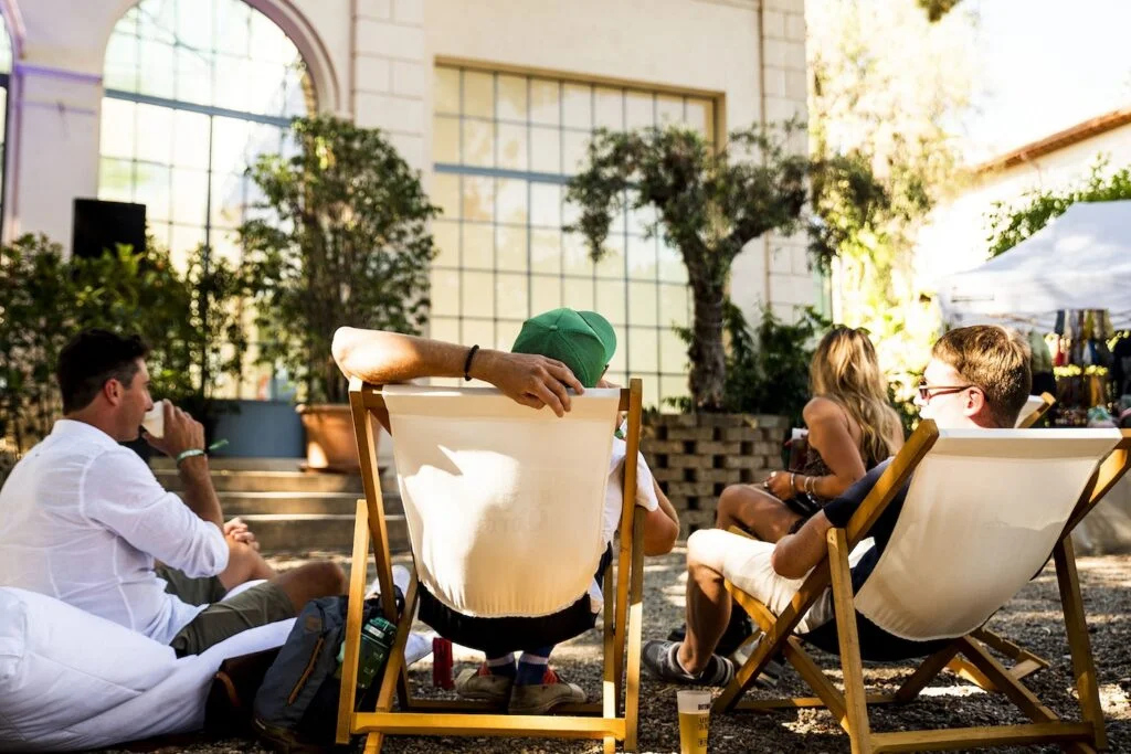 people chilling and drinking during the day festival botanica